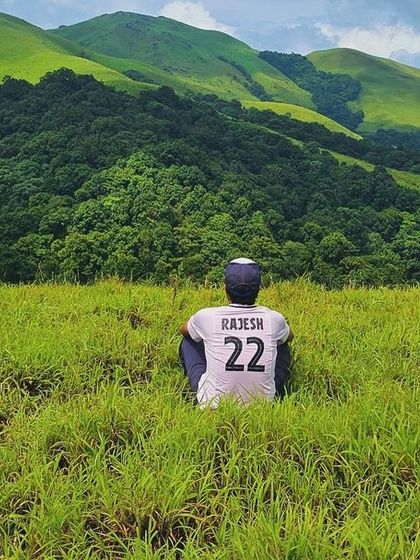 Finding a moment of solitude amidst the vast green meadows of the Bandaje trail.