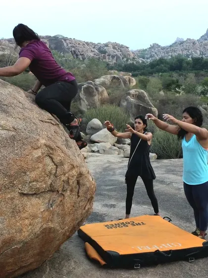 Spotting is an act of trust and community. Here, climbers carefully watch and protect their friend during our 2019 Hampi festival, ensuring she can push her limits safely.