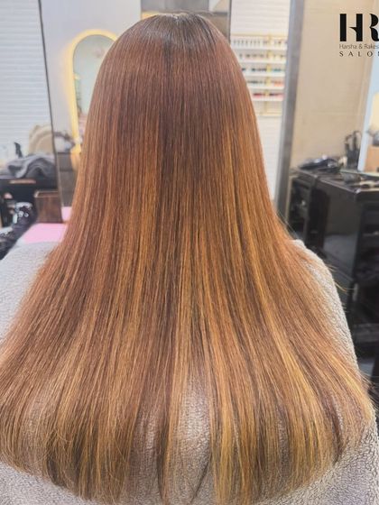This is what we mean by hair that glows. After a Hair Botox treatment, this client's hair is not only frizz-free but also has a beautiful, healthy luster that catches the light perfectly.