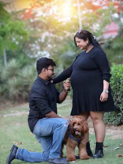 The whole family gets excited for a new arrival, including our furry friends. This outdoor session captures a sweet, candid moment with the family pet, showing that love comes in all forms.