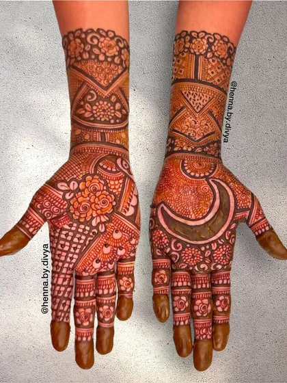 A beautiful and intricate design perfect for Eid celebrations. The highlight is the crescent moon motif on one palm, surrounded by dense floral and geometric patterns that cover the entire hand.