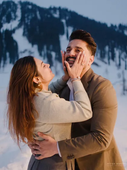 A playful moment in the snow. This candid shot from a Kashmir pre-wedding session captures the fun-loving spirit of the couple.