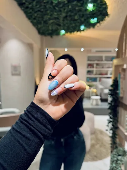 A close-up of a bold, abstract nail art design, showing how we can match your nails to your personal style.