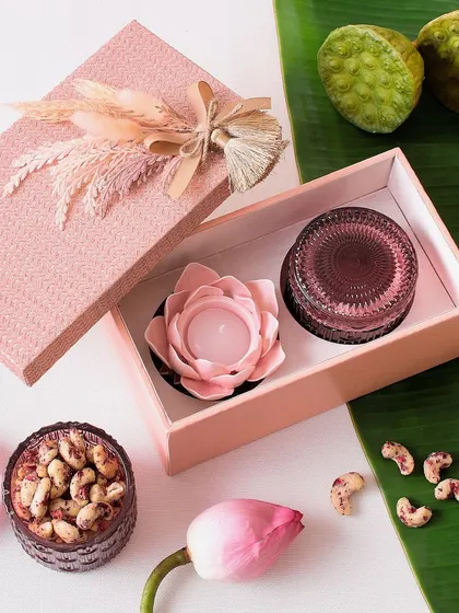 This simple and sweet Diwali hamper includes a lovely flower candle and a jar of our signature cookies, perfect for a warm, personal gift.