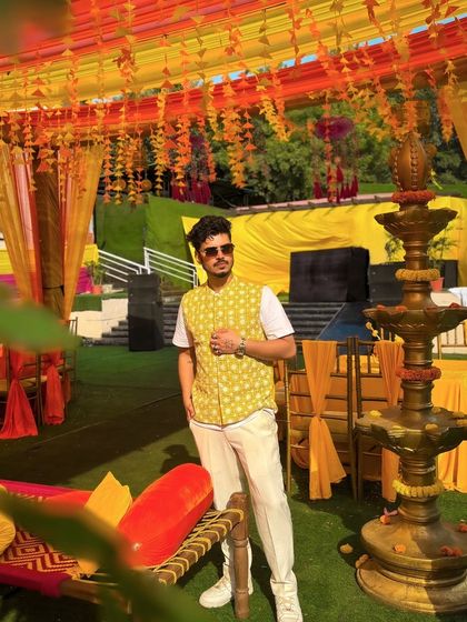 A full-length shot showing the beautiful Haldi decor. I always ensure my setup blends seamlessly with the event's aesthetic while delivering powerful sound.