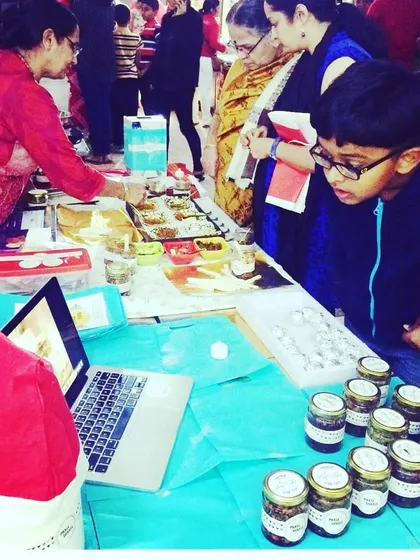 A young customer curiously looking at our products. We love seeing people of all ages enjoy the taste of our homemade snacks.