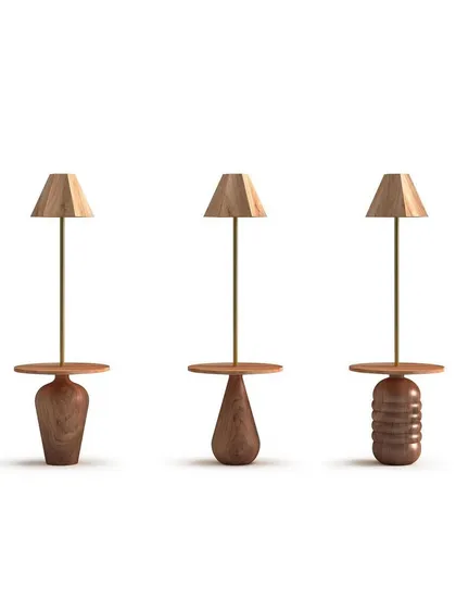 A product showcase of three lamp and table combinations from the 'Bernard and friends' collection. Each piece features a uniquely turned wooden base, celebrating the artistry of woodturning and natural forms.