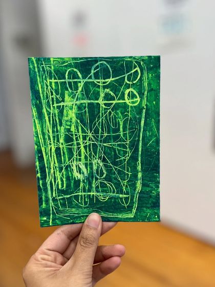 An expressive green abstract artwork from our kids' oil pastel class. We encourage children to explore abstract art to free their creativity without the pressure of realism.