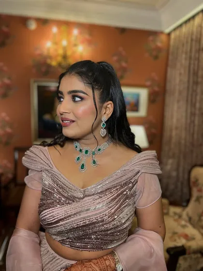 A side profile of the engagement look, showing the beautiful hairstyle and the way the makeup enhances her features.