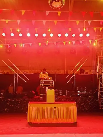 The view from the DJ booth, ready to get the crowd moving. The colorful bunting and disco ball add a classic party vibe to the space.