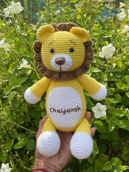 A personalized lion plushie with the name "Chayansh" embroidered on his belly. This sunny yellow lion is ready to be a brave and loyal friend.