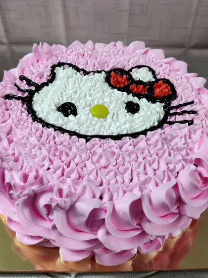 A sweet Hello Kitty cake made with pink and white buttercream rosettes. A timeless character for a lovely celebration.