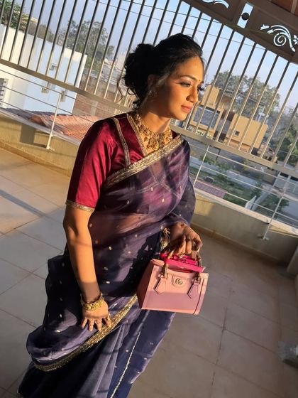 Another view of this chic messy bun. It's a versatile hairstyle that works well with both sarees and modern outfits.