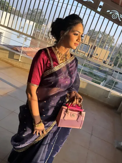 Another view of this chic messy bun. It's a versatile hairstyle that works well with both sarees and modern outfits.