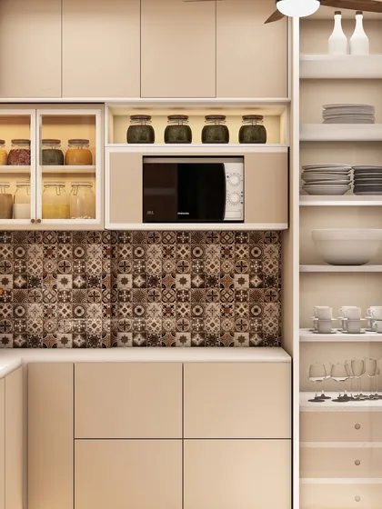 A close-up of the smart storage solutions, including open shelving for crockery and a dedicated space for the microwave.