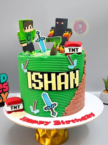 A Minecraft-themed cake for Ishan's 7th birthday, featuring popular characters and TNT blocks.