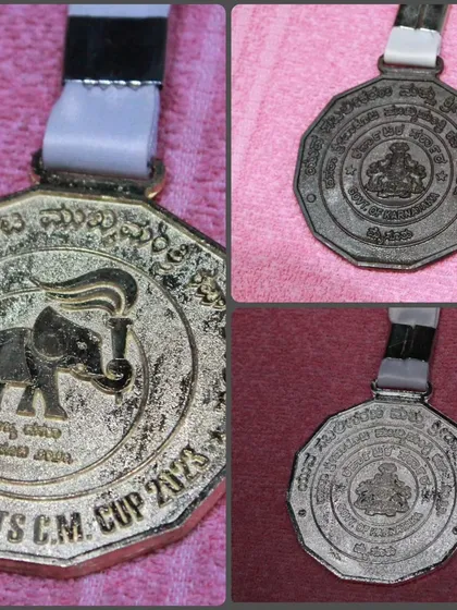 A close-up of the Sports C.M. Cup 2023 medal from the Dasara competition. A symbol of hard work and excellence.
