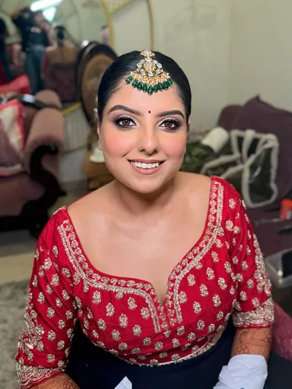 The lovely Drishti, all smiles and ready for her wedding. Her airbrush bridal makeup ensures a flawless, long-lasting finish.