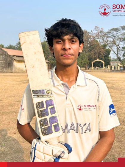Vishesh Kamble poses with his bat after his solid 75-run knock, which led the K. J. Somaiya Polytechnic team to the semi-finals.