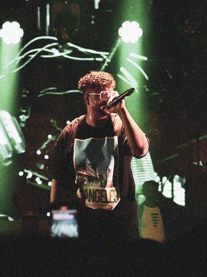 Close up, spitting bars under the green lights. Every word I say, I mean it.