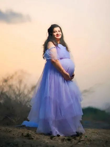 This lavender net gown with its flowing trail looks like it's straight out of a fairytale, especially when captured in the soft light of dusk.