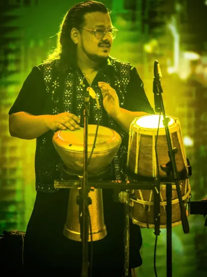 Our percussionist, surrounded by his instruments, creating the intricate rhythms that are a hallmark of our sound.