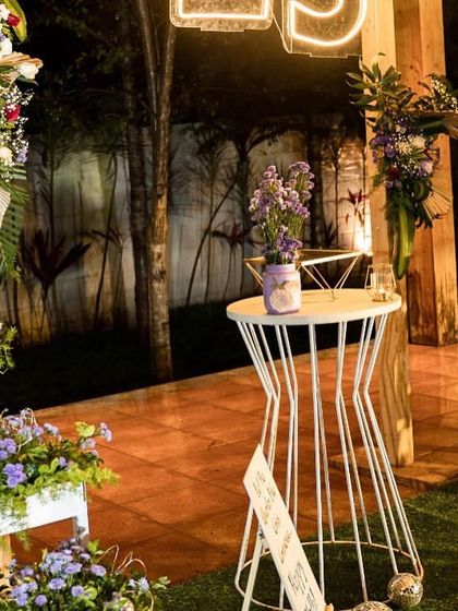 A closer look at the details of the rustic 25th birthday setup. I used a mix of fresh and dried florals, candles, and personalized signs to create a warm and inviting atmosphere for the intimate celebration.