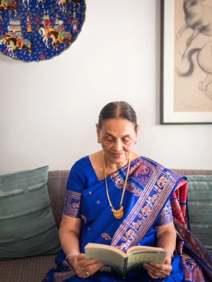A quiet, candid moment of her reading a book. These lifestyle shots are just as important as posed portraits, as they capture the simple, everyday activities that tell the story of a person's life.