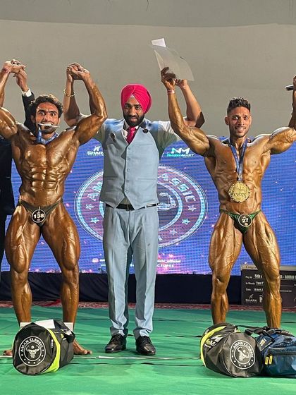 Celebrating the win on stage. A moment of triumph.