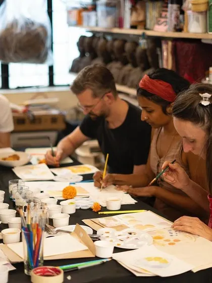 A group of creators completely absorbed in one of our botanical ink painting workshops. We love hosting these intimate sessions where artists can gather around a table, share ideas, and learn a new skill together in a relaxed, supportive environment.