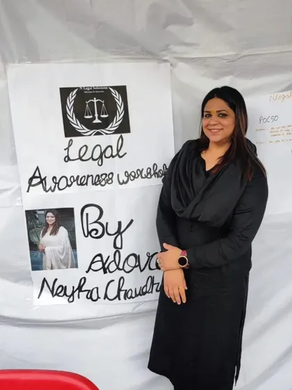Standing proudly beside a handmade poster for my legal awareness workshop. The effort and warmth from the community members at the Shubham Tyagi Foundation were truly touching.