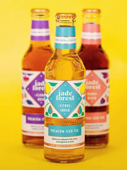 We used a bright, high-key lighting setup with a complementary color background for Jade Forest's iced tea. This approach makes the beverage look refreshing and vibrant, perfect for a summer product launch.