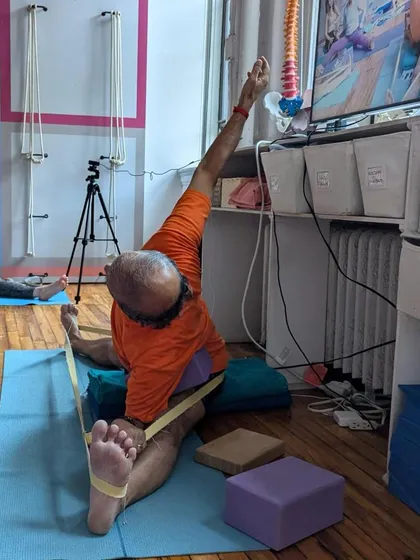 A seated forward bend, Parivrtta Janu Sirsasana.