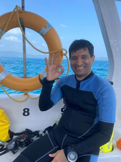 A smiling diver gives the "OK" sign. Every dive in the Andamans is an adventure.