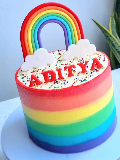 A side view of the buttercream rainbow cake.