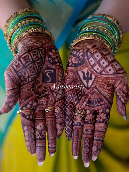 The magic is in the color. I use my own 100% natural henna paste, which guarantees a rich, deep, and long-lasting stain for your wedding festivities.