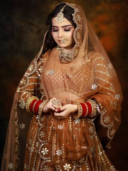 A full shot of the bride, capturing the grace and elegance of the complete look.