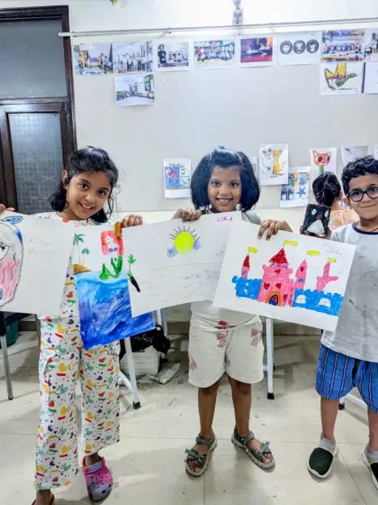 Our little artists with their big imaginations. This trio from our junior batch is excited to show their latest works, featuring a cute owl, a sunny landscape, and a pink castle.