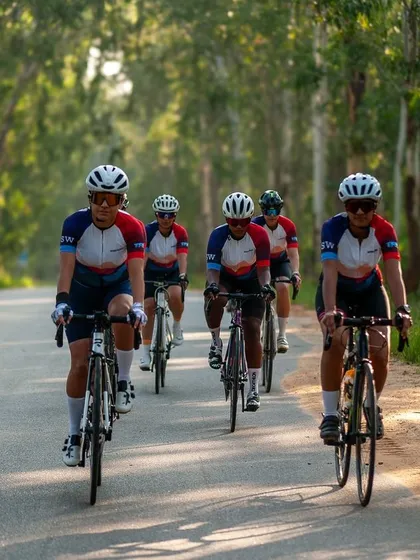 Sisterhood on the road. This is what we're all about. A group of us riding in formation through the scenic roads near Nandi Hills, all wearing our 'Mountains Are Calling' club kit. This is performance athletic apparel that unites us as a team.