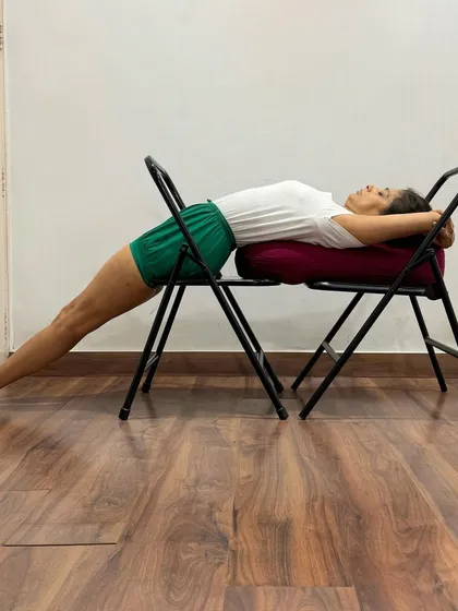 Using two chairs in Purvottanasana provides stability and height, allowing for a deeper arch in the upper back. This variation helps to build strength in the arms and legs while focusing on the chest-opening aspect of the pose.