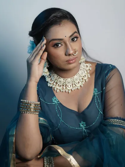 A close-up portrait that captures the modern aesthetic of the makeup.