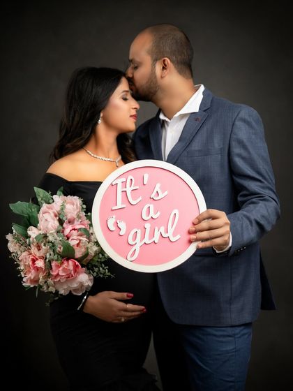 It's a girl! A gender reveal photo is a joyful part of the journey. I have a variety of signs and props in the studio to help you make your big announcement.