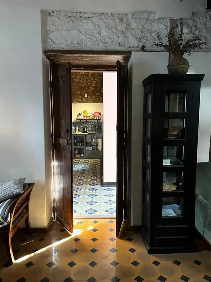 Light is a mood changer. Here, the winter sun streams through an old doorway in the studio, casting long shadows on the original patterned floor tiles. It’s moments like these that remind me of the quiet, soulful energy of this restored space.