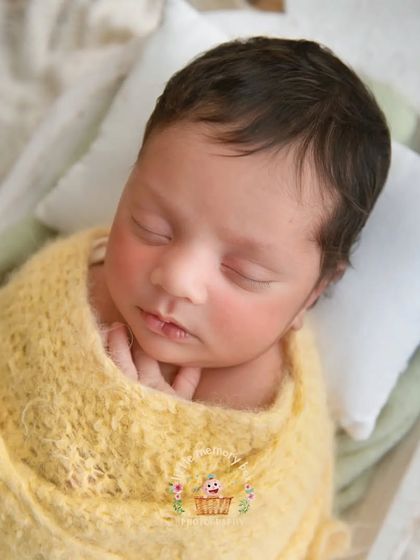 A close-up on this little sweetheart's face. You can see the soft blush on their cheeks. These are the details you'll want to remember forever.