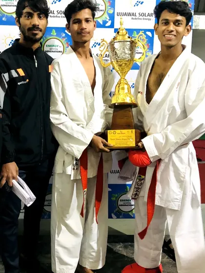 With my senior students and their team trophy. Their leadership and skill are the backbone of our academy.