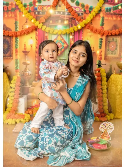 A mother and son portrait from our Diwali mini-session. The warm, festive backdrop creates a beautiful setting for a family memory.