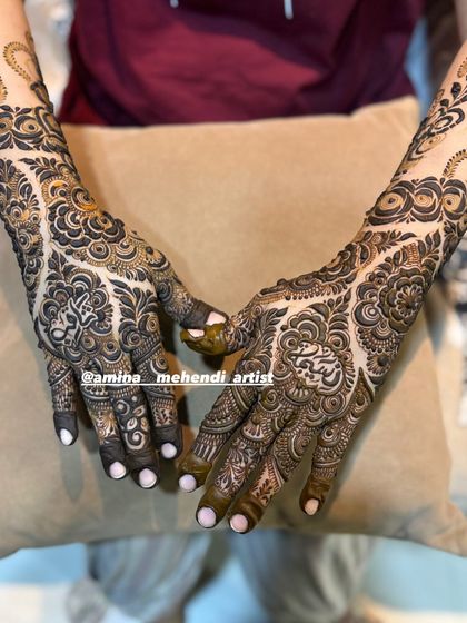 This design uses negative space beautifully, with elegant vines creating a border at the top of the arms.