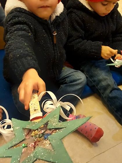 Serious magic-making in progress! These wishing wands, made by my 3 to 5-year-olds, are filled with sequins and sparkles.