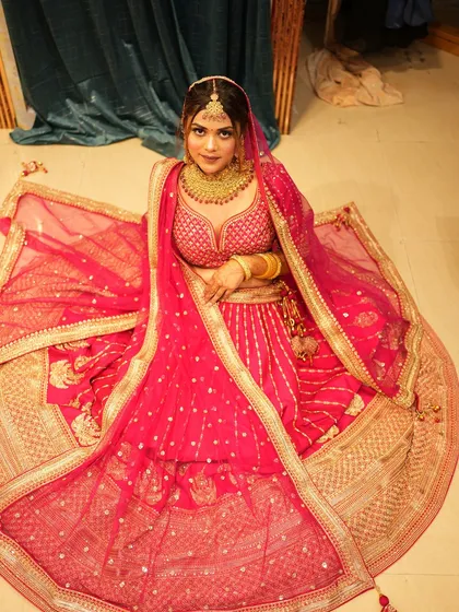 Explore our diverse collection of traditional red and pink bridal lehengas. Each piece, whether in rich velvet or silk, features unique embroidery and is designed to make your wedding day unforgettable.