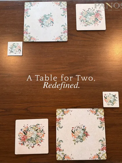 A table for two, redefined. This flat lay showcases our coordinated floral collection, including placemats and coasters in various sizes, designed to bring a touch of botanical elegance to your table.